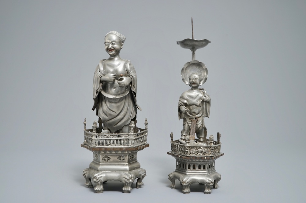 A Chinese pewter candlestick and a figure of a boy, 19/20th C.