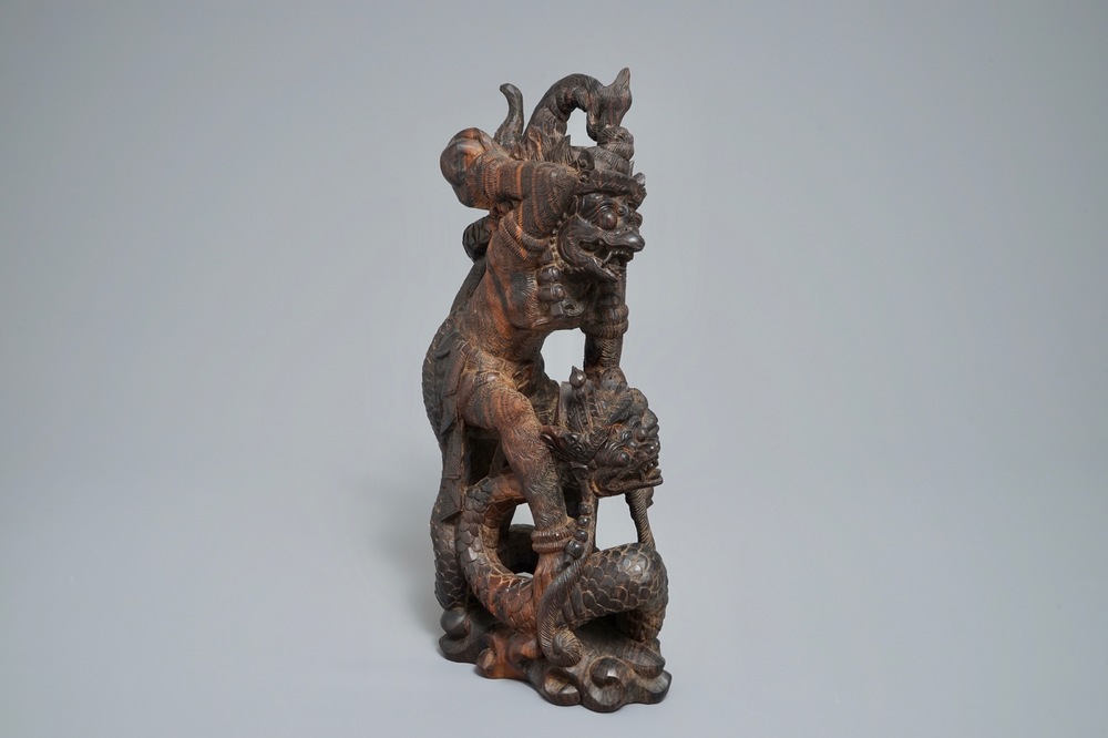 An Indonesian calamandar wooden sculpture of Vishnu riding Naga, 19th C.