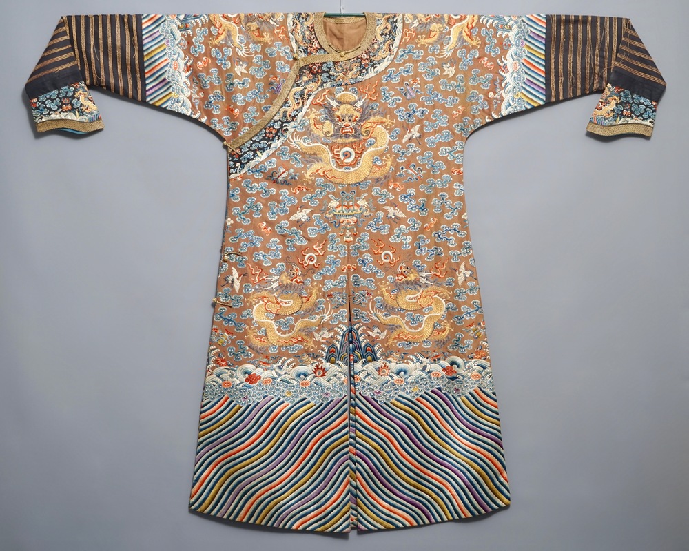 A Chinese imperial brown-ground kesi eight-dragon robe, probably Jiaqing, 1st half 19th C.