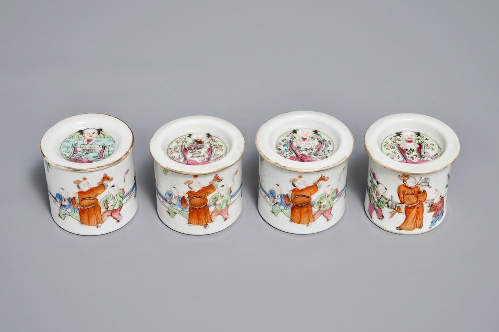 Four cylindrical Chinese famille rose covered boxes, 19th C.