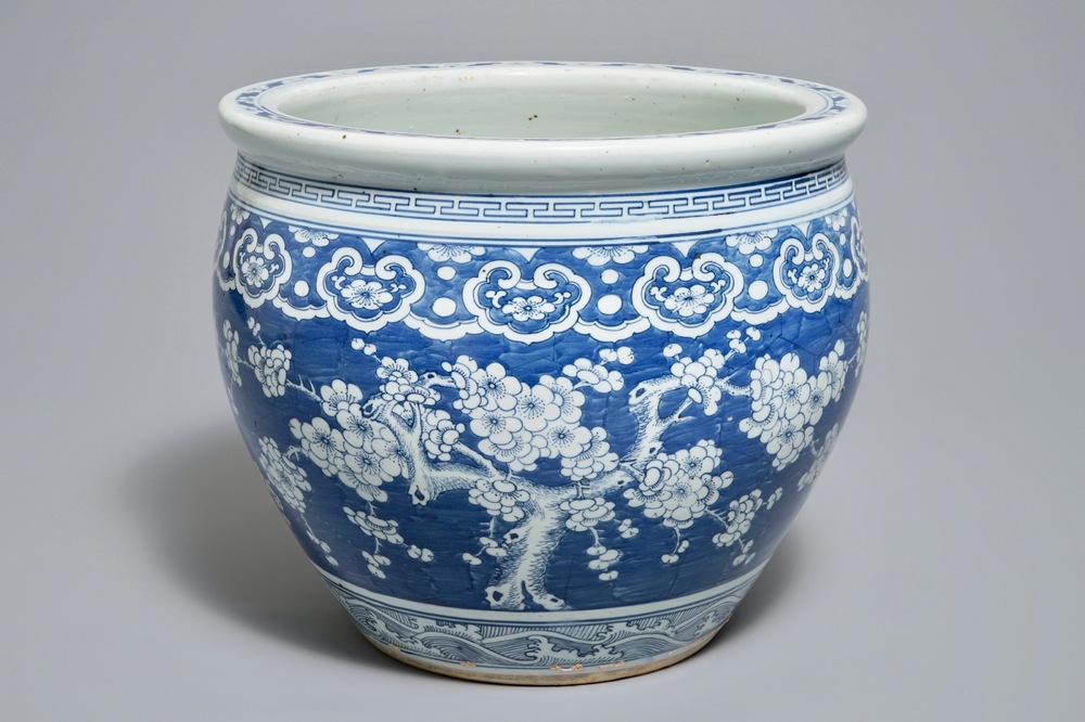 A Chinese blue and white fish bowl with design of prunus on cracked ice, 19th C.