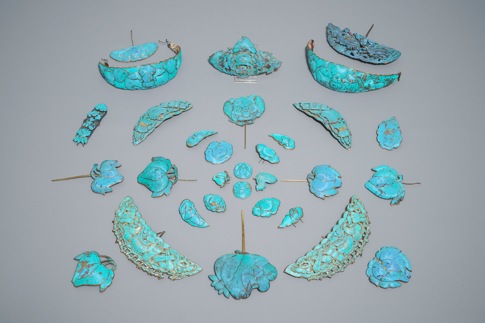 Thirty-one Chinese kingfisher feather ornaments in silver and gilt metal, Qing and 20th C.