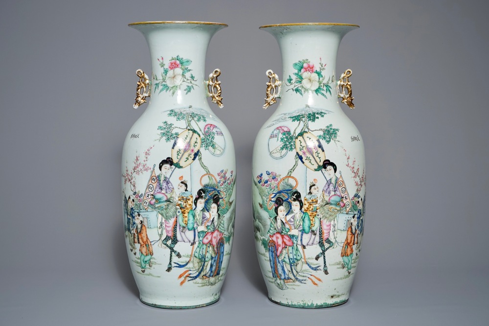 A pair of Chinese famille rose vases with figures in a garden, 19/20th C.