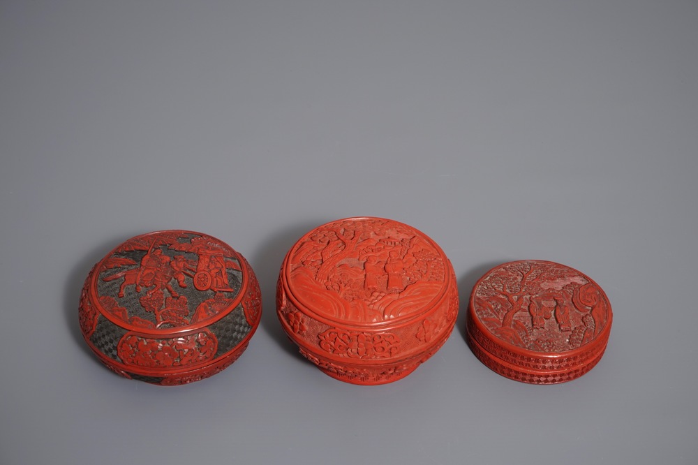 Three round Chinese cinnabar lacquer covered boxes with figures in landscapes, 19/20th C.