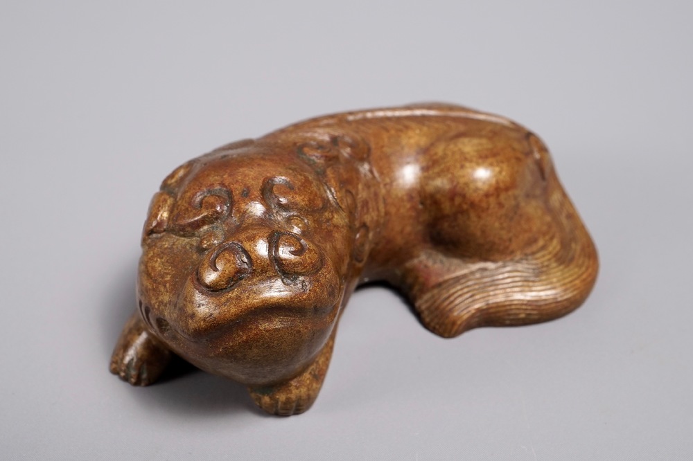 A Chinese bronze scroll or paper weight shaped as a Buddhist lion or Shishi, 18/19th C.