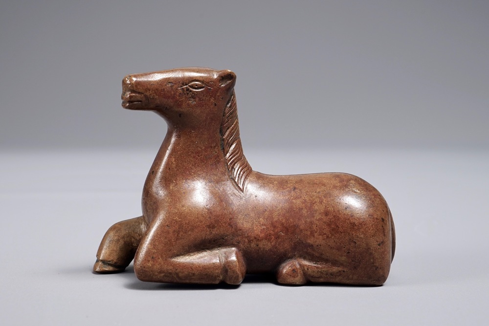 A Chinese bronze scroll or paper weight shaped as a recumbent horse, 19/20th C.