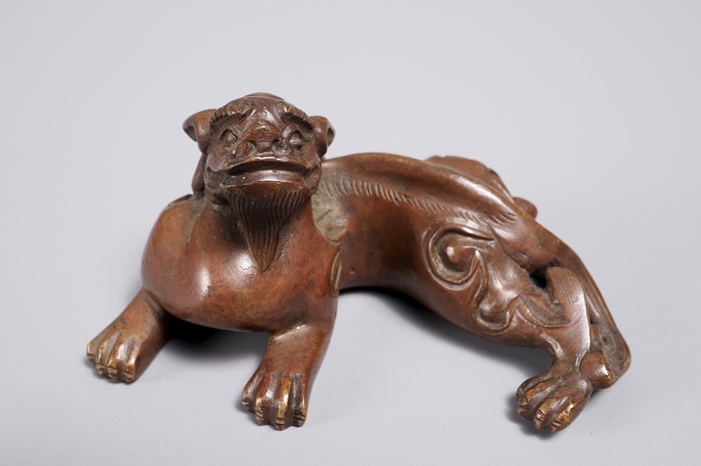 A Chinese bronze scroll or paper weight shaped as a chilong, 18/19th C.