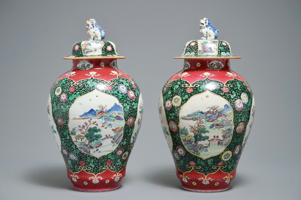 A pair of Chinese famille rose black-ground vases and covers, Yongzheng
