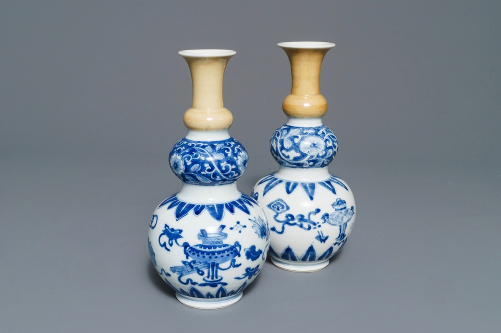 A pair of Chinese blue and white with cafe-au-lait triple gourd vases, Kangxi