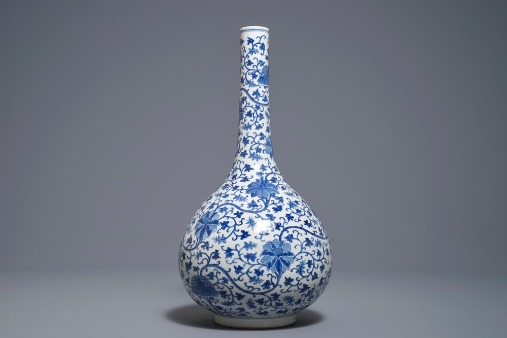 A Chinese blue and white 'lotus scroll' bottle vase, 18/19th C.