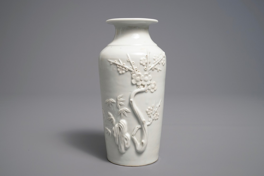 A Chinese Dehua blanc de Chine rouleau vase with incised and applied design, Kangxi