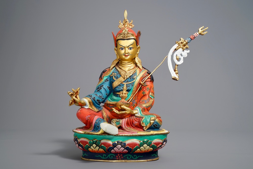 A Sino-Tibetan gilt and polychromed bronze figure of Padmasambhava, 20th C.