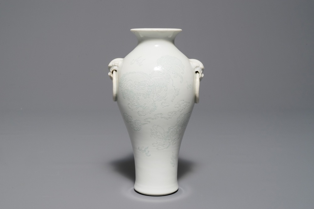 A Chinese Dehua blanc de Chine meiping vase with anhua design of Buddhist lions, Kangxi