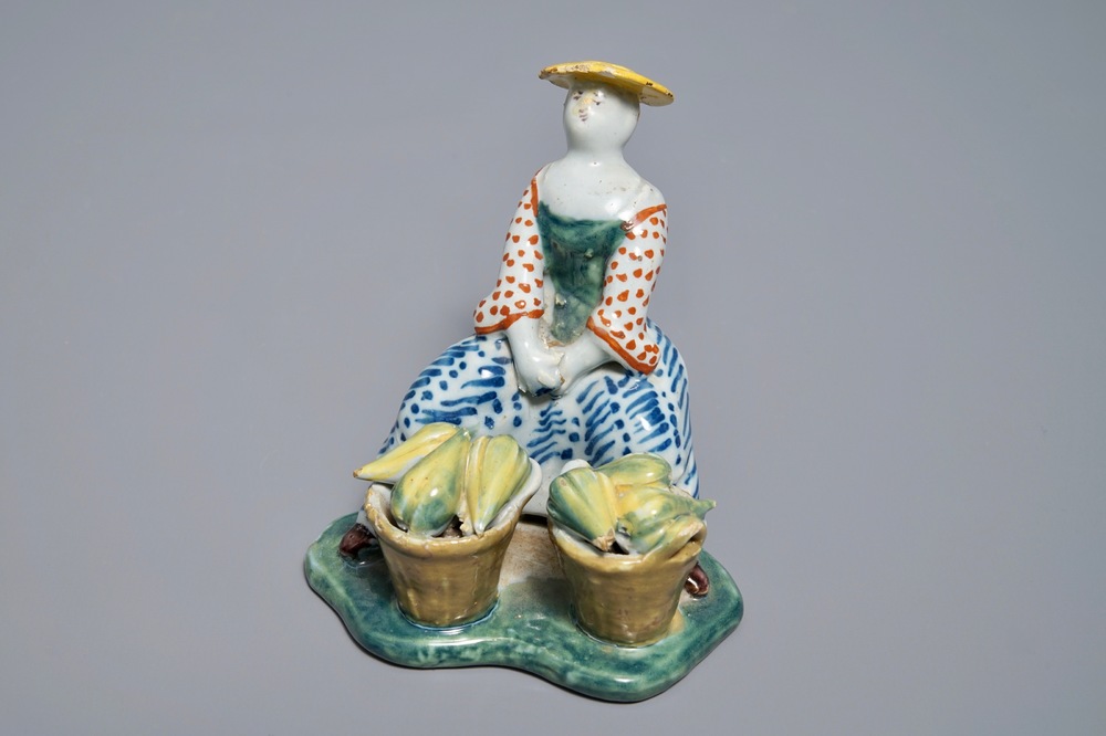 A polychrome Dutch Delft model of a melon seller, 18th C.
