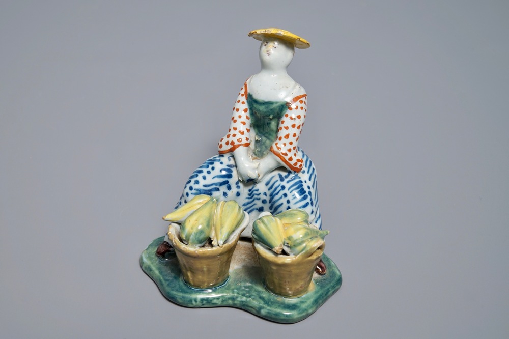 Un mod&egrave;le d'une marchande de melons en fa&iuml;ence polychrome de Delft, 18&egrave;me