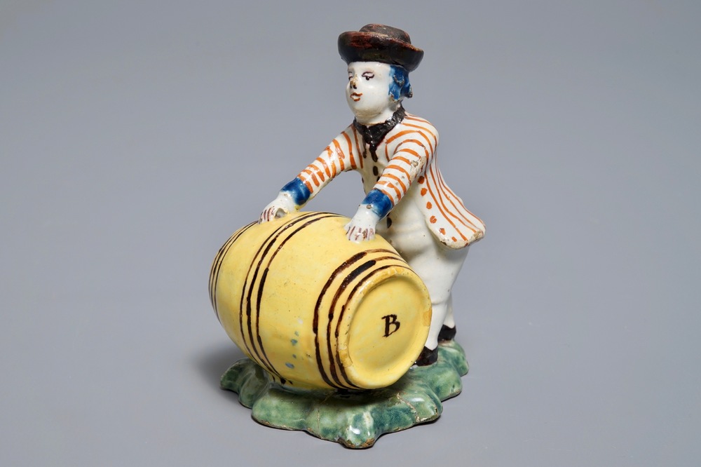 A polychrome Dutch Delft model of a wine merchant, 18th C.