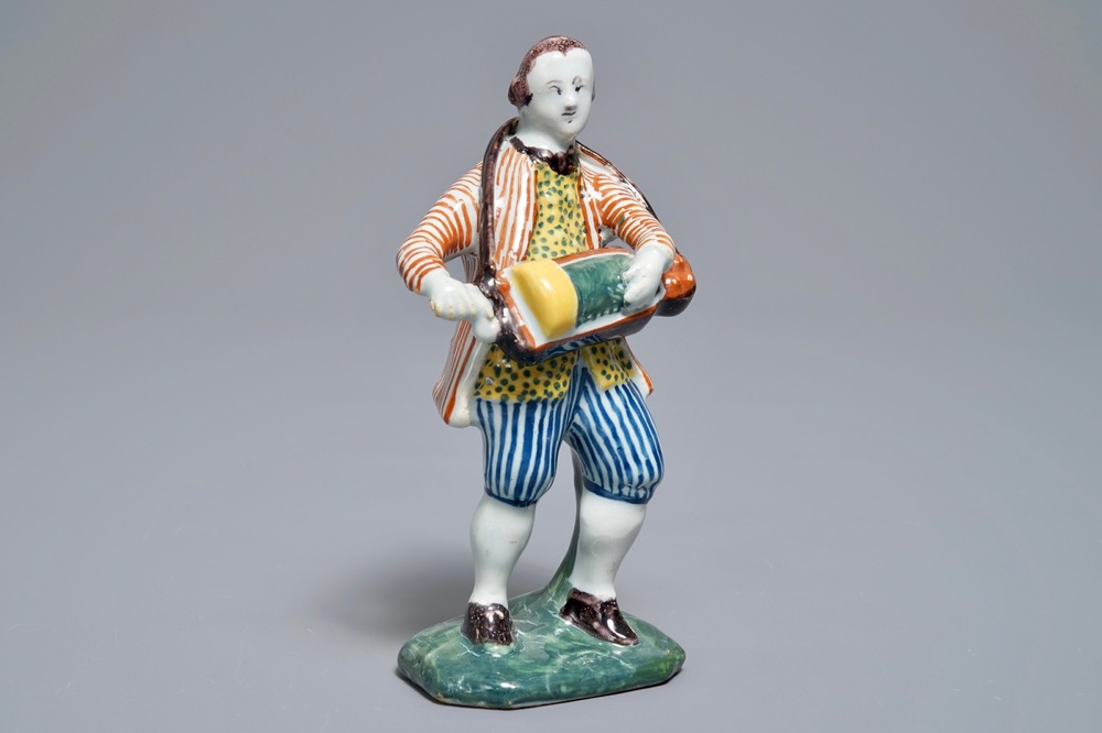 A polychrome Dutch Delft model of a hurdy-gurdy player, 18th C.