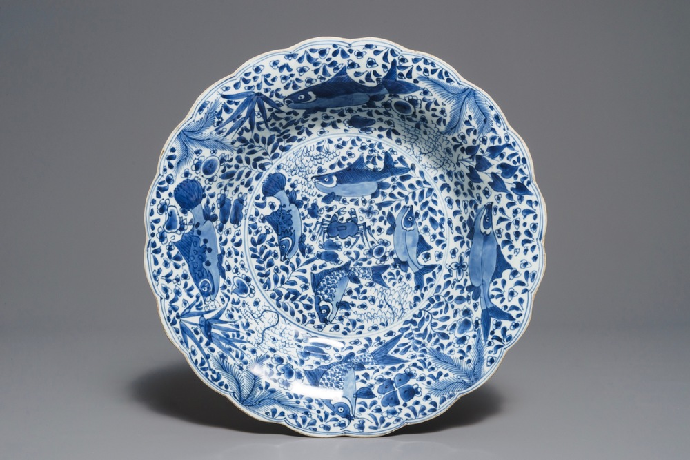 A lobed Chinese blue and white dish with fish, Kangxi