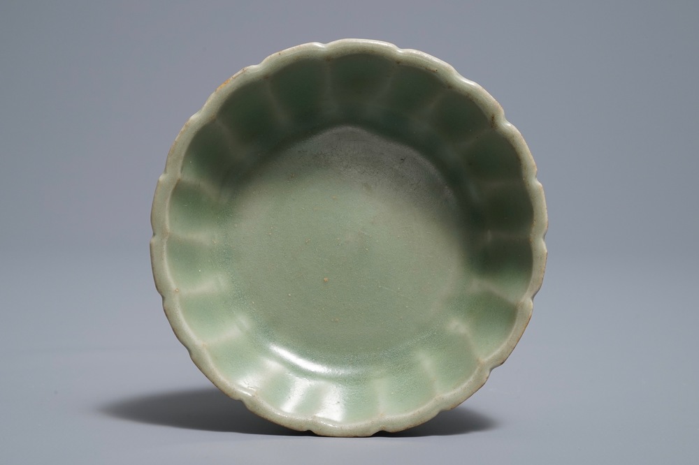 A small moulded Longquan celadon 'chrysanthemum' bowl, Song or Ming