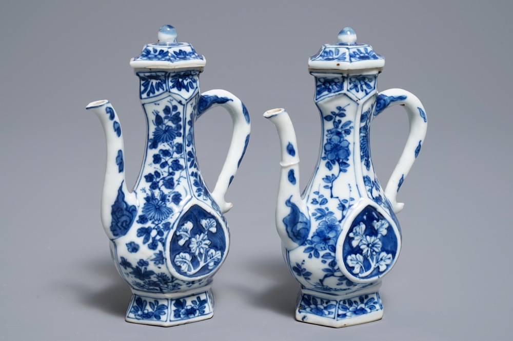 A pair of Chinese blue and white ewers and covers with floral design, Kangxi