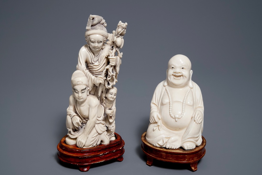 A Chinese ivory group of a family and a 'laughing Buddha' figure, ca. 1900