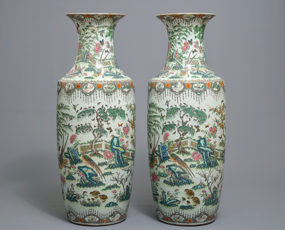 A pair of large Chinese famille rose vases with birds in a garden, 19th C.