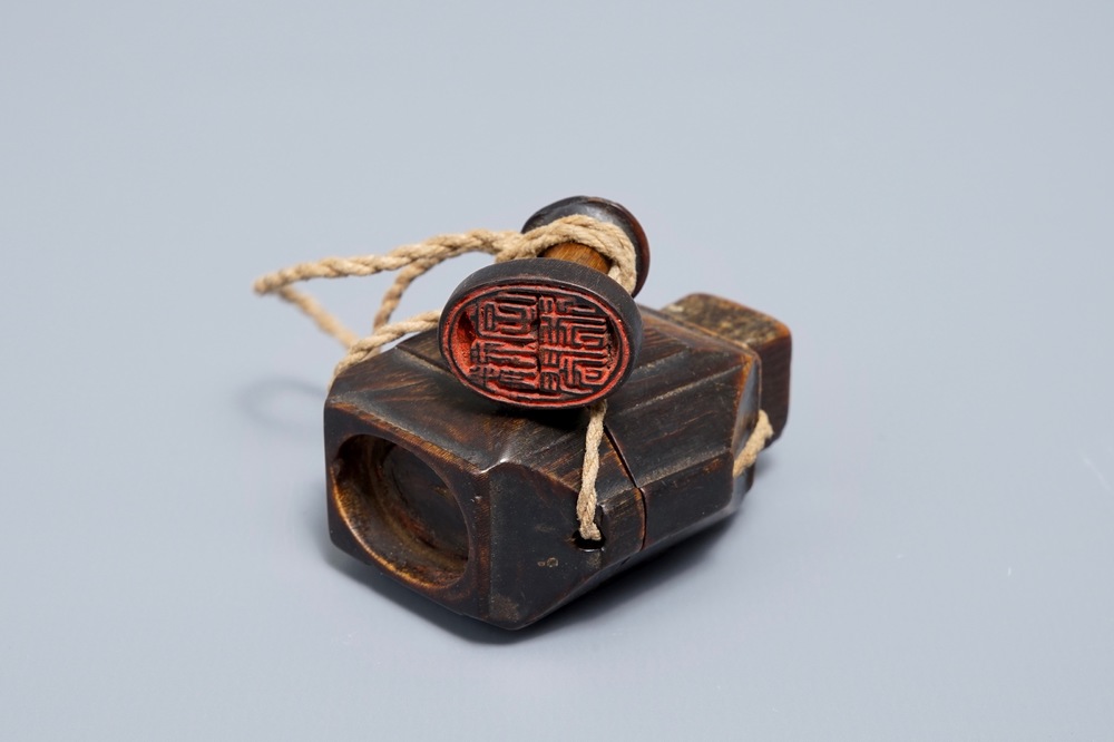 A Chinese rhinoceros horn seal and paste container, 19th C.