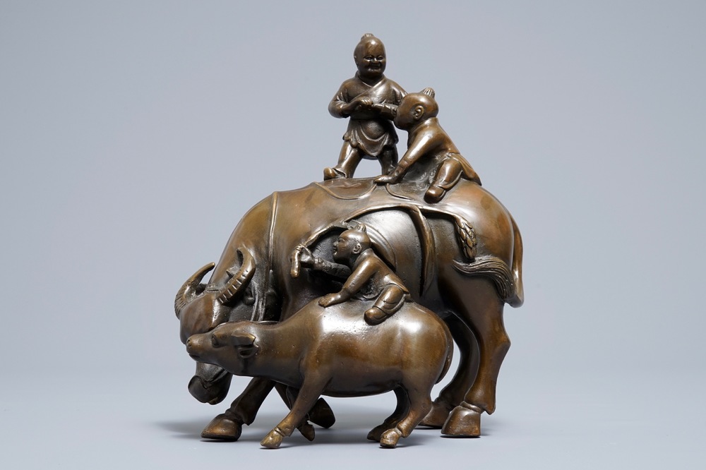 A Chinese bronze group with boys and buffaloes, 19th C.