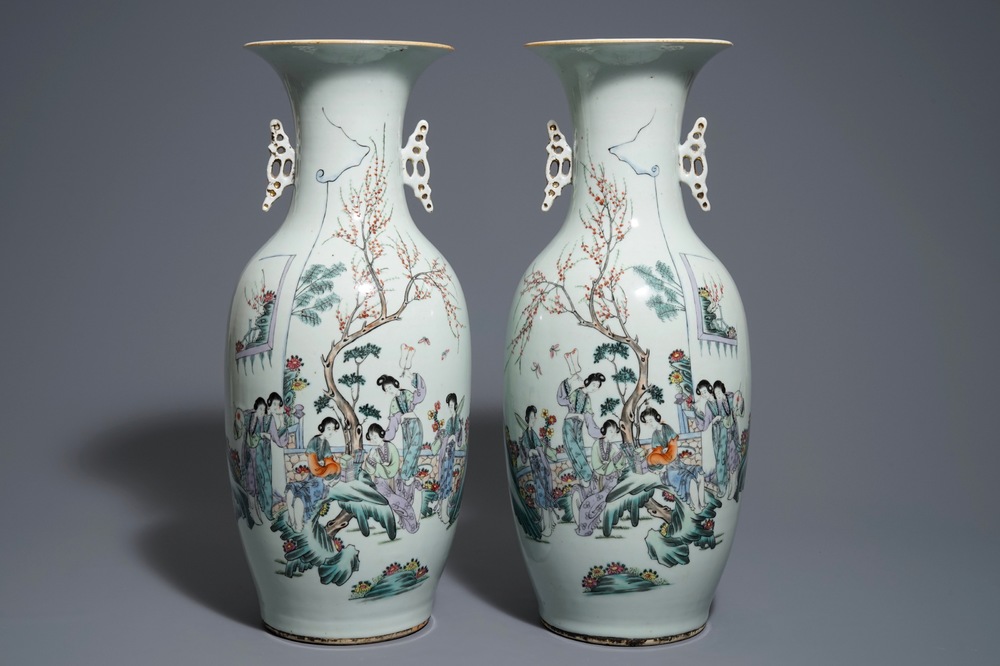 A pair of Chinese qianjiang cai vases with figures in a garden, 19/20th C.