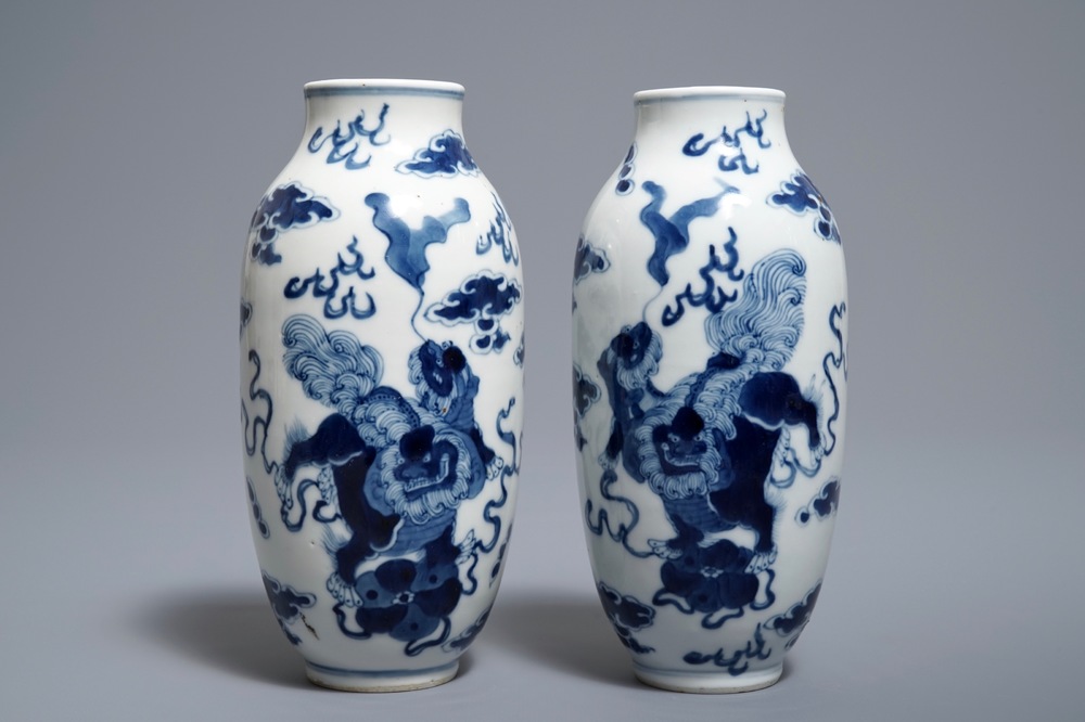 A pair of Chinese blue and white 'buddhist lions' vases, Kangxi mark, 19th C.