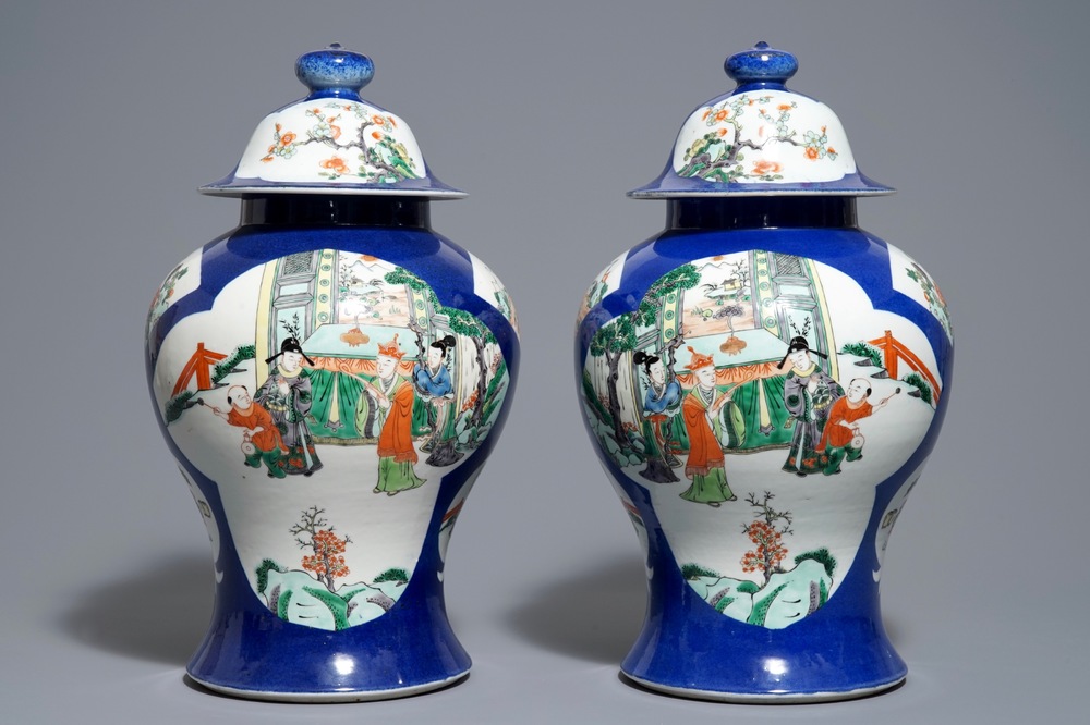 A pair of Chinese famille verte blue ground vases and covers, 19th C.