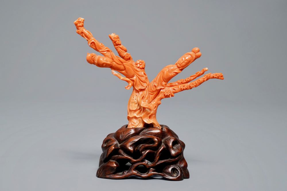 A Chinese carved red coral group of two ladies on wooden stand, 19/20th C.