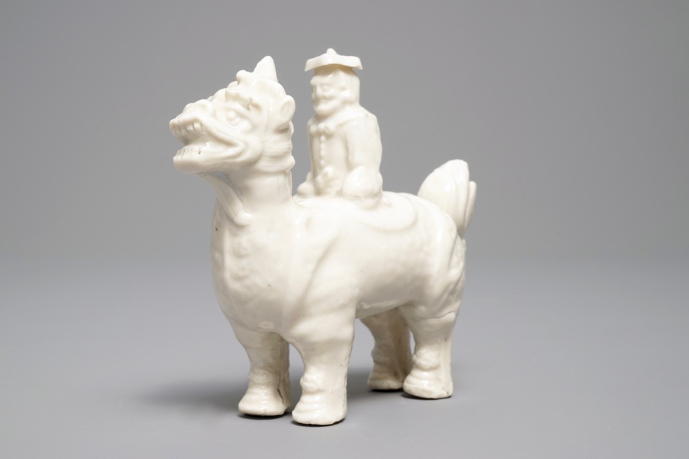 A Chinese Dehua blanc de Chine model of a man on a qilin, Kangxi