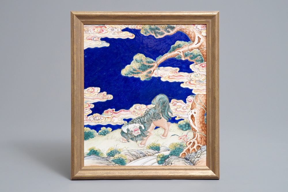 A Chinese Canton enamel plaque with a Buddhist lion in a landscape, Qianlong