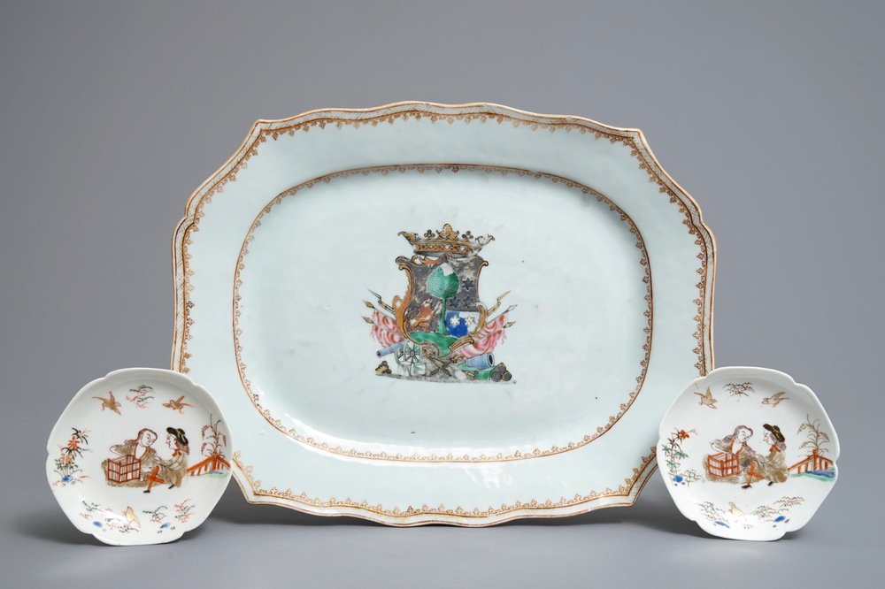 A Chinese famille rose armorial platter and two eggshell saucers after Cornelis Pronk, Yongzheng/Qianlong