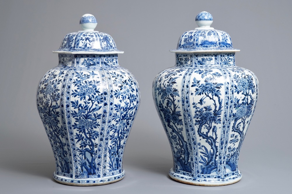 A pair of large Chinese blue and white octagonal baluster vases and covers, Kangxi