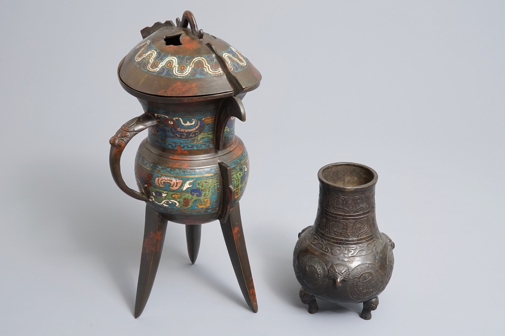 A Chinese bronze tripod vase and a cloisonn&eacute; ritual wine cup, jue, 18/19th C.