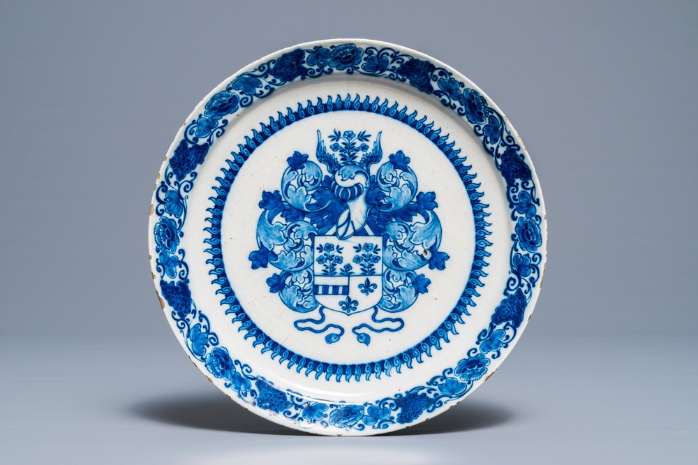 A Dutch Delft blue and white armorial dish, 17/18th C.