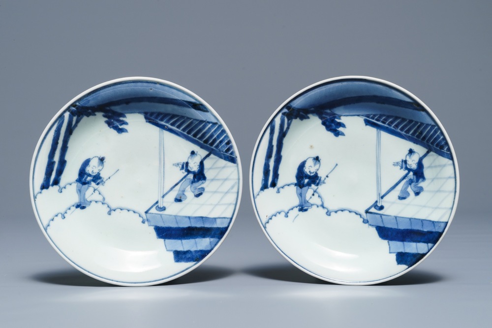 A pair of Japanese Arita blue and white plates with playing boys, Arita, Edo, 18th C.