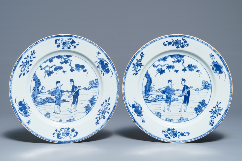 A pair of Chinese blue and white dishes with ladies in a garden, Yongzheng/Qianlong