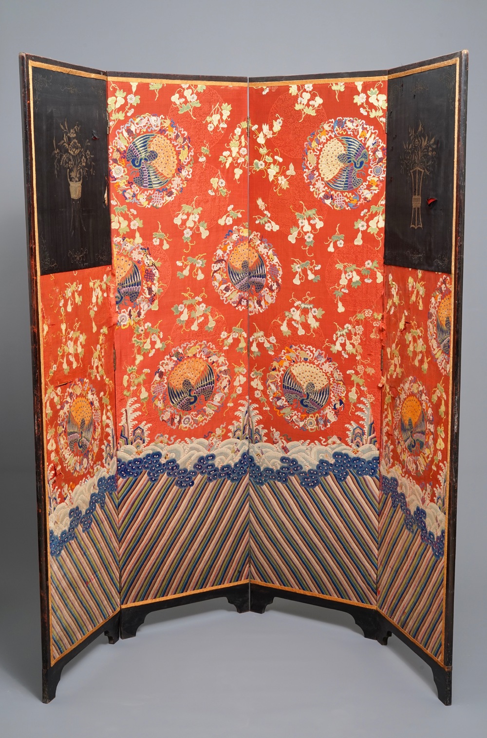 A Chinese folding screen with silk embroidery of phoenixes on a red ground, Qianlong