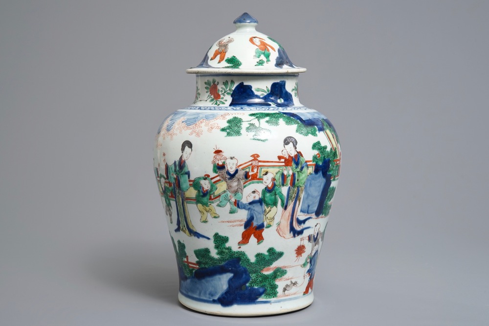 A Chinese wucai baluster vase and cover with playing boys, Transitional period