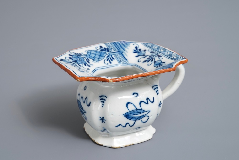 A Dutch Delft blue and white chinoiserie spittoon, 18th C.