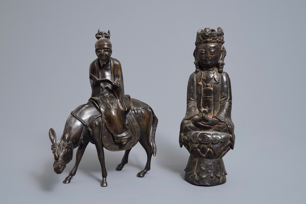 A Chinese bronze Guanyin and a group with a scholar riding a donkey, Ming and later