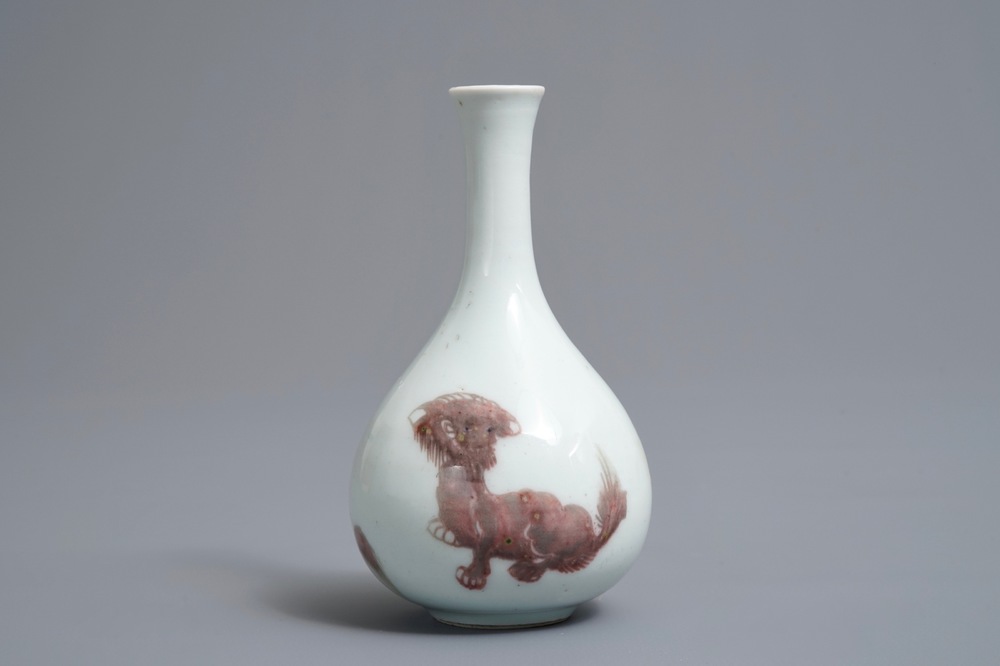 A Chinese copper-red bottle vase with mythical creatures, Kangxi