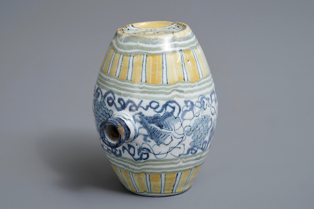 A polychrome Dutch Delft barrel-shaped gin flask with grape vines, 18th C.