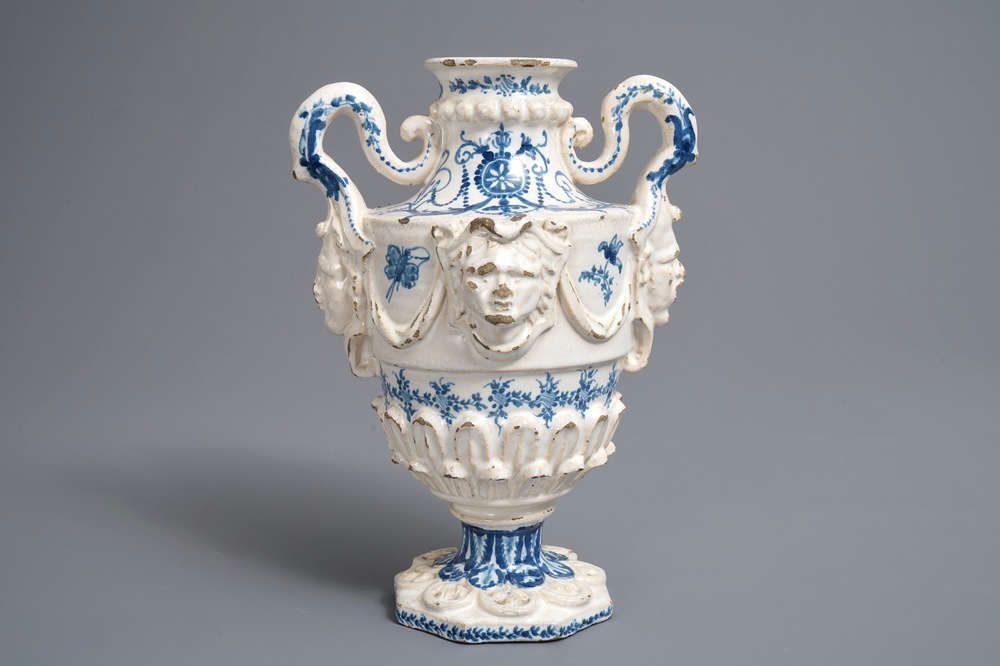 A Spanish blue and white two-handled vase with applied design and dedication, dated 1801