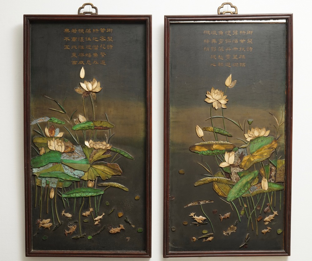 A pair of large Chinese lacquered wood inscribed panels with applied ivory, Qianlong