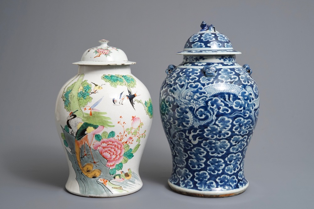 Two Chinese blue and white and famille rose vases and covers, 19/20th C.