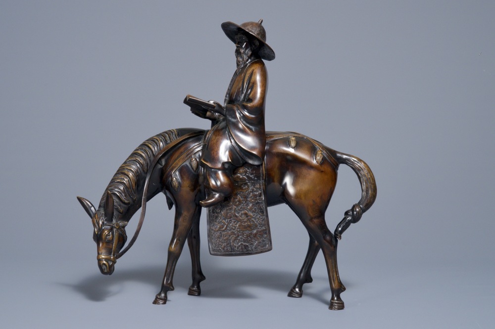 A large Japanese bronze group of a sage on horseback, Meiji, 19th C.